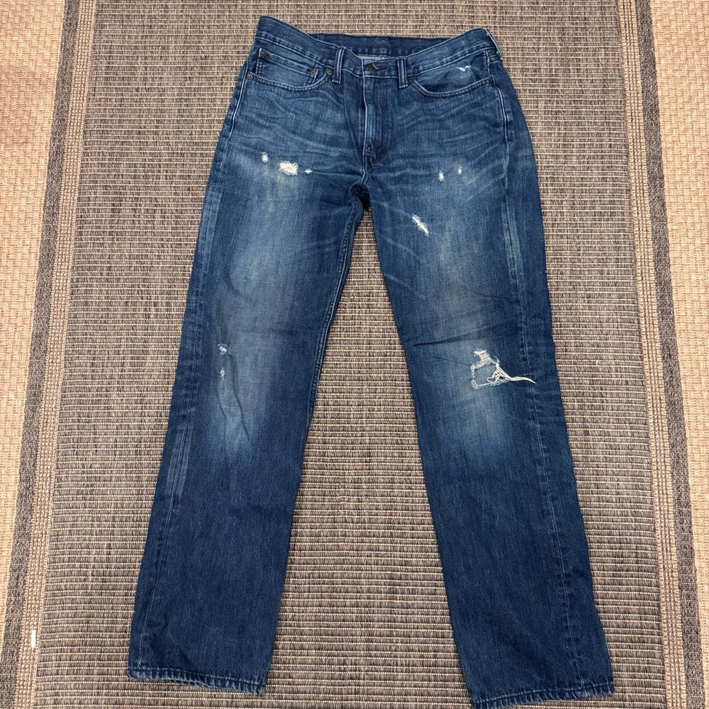 Levi's Men's 514 Straight Jeans in Medium Blue with Distressing